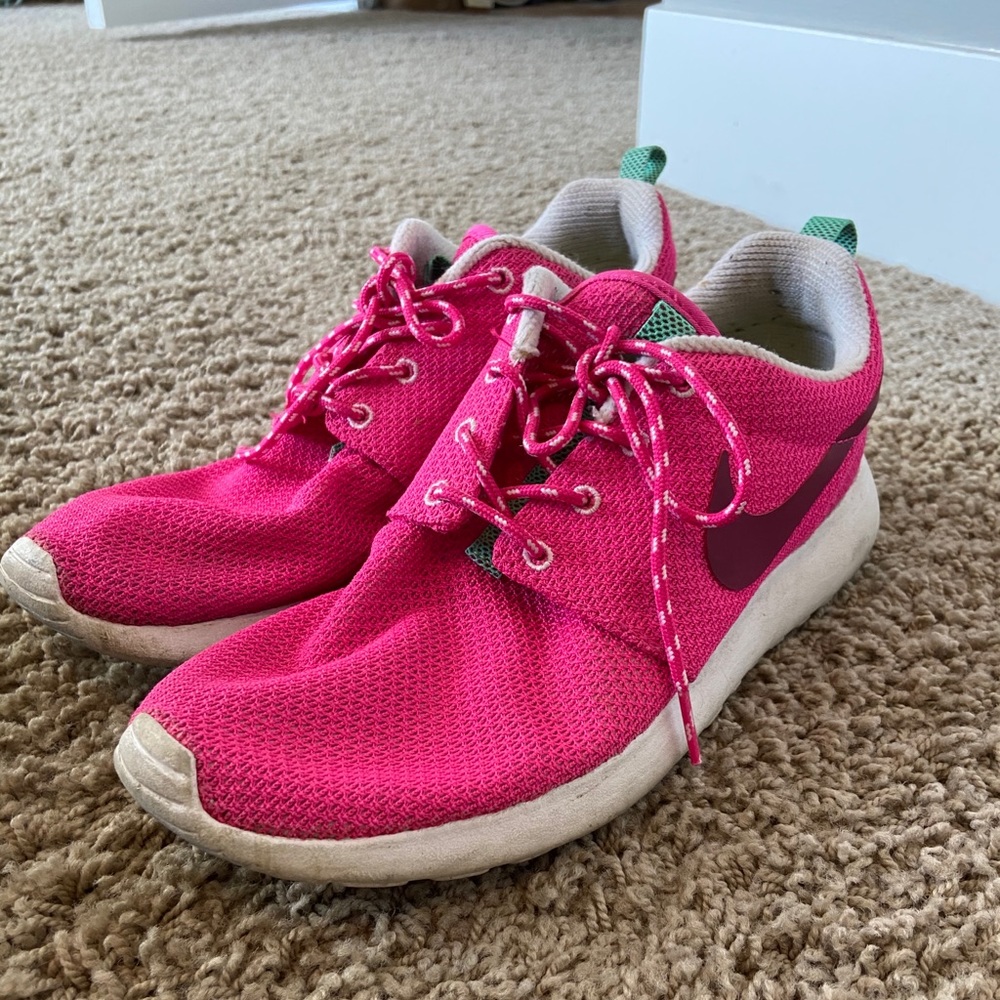 Pink Nike running shoes